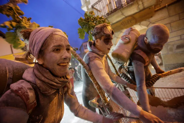 Revellers participate in a flour fight during the “O Entroido” festival in Laza village, Spain February 27, 2017. (Photo by Miguel Vidal/Reuters)