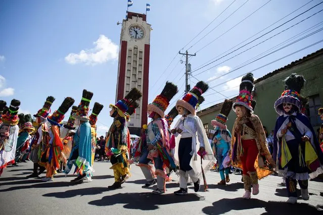 Parishioners take part in El Gueguense, a satyrical drama and an expression of protest against the colonial rule to mark the Feast of Saint Sebastian, in Diriamba, Nicaragua on January 19, 2022. (Photo by Maynor Valenzuela/Reuters)