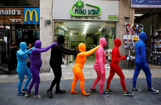 Members of the Prizma Ensemble wearing full solid-coloured bodysuits take part in the 6th Jane's Walk Jerusalem in Jerusalem May 6, 2016. (Photo by Baz Ratner/Reuters)