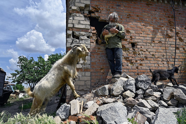 Viktor Zinchenko, 67, who takes care of a herd of 50 goats, shows a corner of his house damaged by Russian artillery fire in Orikhiv, a city in Zaporizhzhia region in southeastern Ukraine, close to the front line. (Photo by Dmytro Smolienko/Ukrinform/Future Publishing via Getty Images)