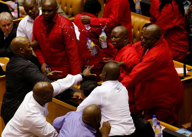 Party leader Julius Malema and members of his Economic Freedom Fighters (EFF) clash with Parliamentary security as they are evicted from the chamber in Cape Town, South Africa, May 17, 2016. (Photo by Mike Hutchings/Reuters)