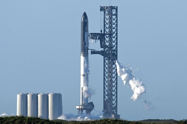 The SpaceX Starship rocket stands on the launchpad from the SpaceX Starbase in Boca Chica as seen from South Padre Island, Texas on April 17, 2023. SpaceX on Monday postponed the first test flight of Starship, the most powerful rocket ever built. Liftoff of the giant rocket was called off just minutes ahead of the scheduled launch time because of a pressurization issue, SpaceX officials said. (Photo by Patrick T. Fallon/AFP Photo)