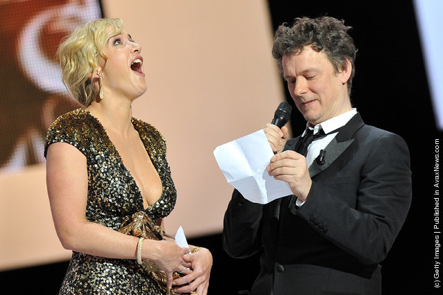 Kate Winslet reacts as Michel Gondry awards her with the Cesar of Honour during the 37th Cesar Film Awards at Theatre du Chatelet