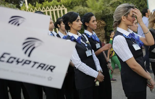 EgyptAir hostesses line up during a candlelight vigil for the victims of EgyptAir flight 804 in Cairo, Egypt, Thursday, May 26, 2016. The cause of Thursday's crash of the EgyptAir jet flying from Paris to Cairo that killed all 66 people aboard still has not been determined. Ships and planes from Egypt, Greece, France, the United States and other nations are searching the Mediterranean Sea north of the Egyptian port of Alexandria for the jet's voice and flight data recorders. (Photo by Amr Nabil/AP Photo)