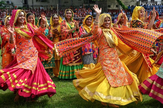 School girls perform 'giddha', a popular folk dance, during full dress rehearsal for the upcoming India's Independence Day celebrations in Amritsar on August 13, 2024. (Photo by Narinder Nanu/AFP Photo)