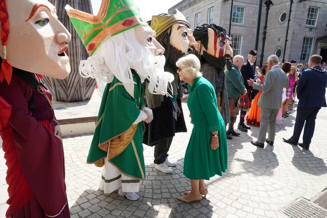 King Charles III and Queen Camilla meets characters representing legendary and historical characters associated with Armagh during a visit to Market Theatre Square, Armagh, Co Armagh as part of a two day visit to Northern Ireland on Thursday, May 25, 2023. (Photo by Brian Lawless/Pool via Reuters)