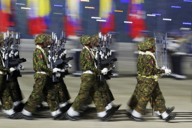 Myanmar military officers march during a parade to commemorate Myanmar's 79th Armed Forces Day, in Naypyitaw, Myanmar, Wednesday, March 27, 2024. (Photo by Aung Shine Oo/AP Photo)