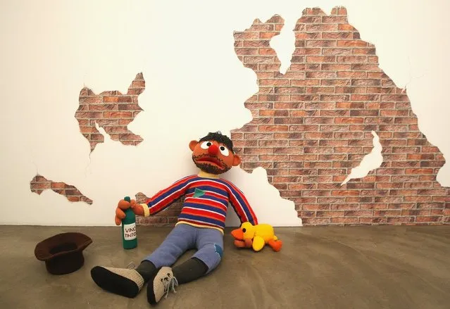 The knitted sculpture 'Ernie' by Patricia Waller, featuring the children's television program star as a desperate alcoholic, sits in the 'Broken Heroes' exhibition at the Deschler Gallery