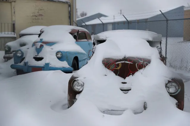 Snow-covered vintage cars are snow-covered in a parking lot after a snow fall at Waterloo, Iowa, U.S., January 19, 2020. (Photo by Ivan Alvarado/Reuters)