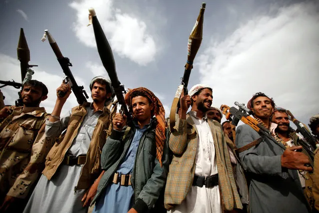 Houthi fighters carry their weapons as they attend a tribal gathering in Sanaa, Yemen June 20, 2016. (Photo by Khaled Abdullah/Reuters)
