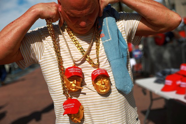 A person sells chains depicting Republican presidential nominee and former President Donald Trump outside a campaign event, sponsored by conservative group Turning Point USA, in Las Vegas, Nevada, on October 24, 2024. (Photo by Eloisa Lopez/Reuters)