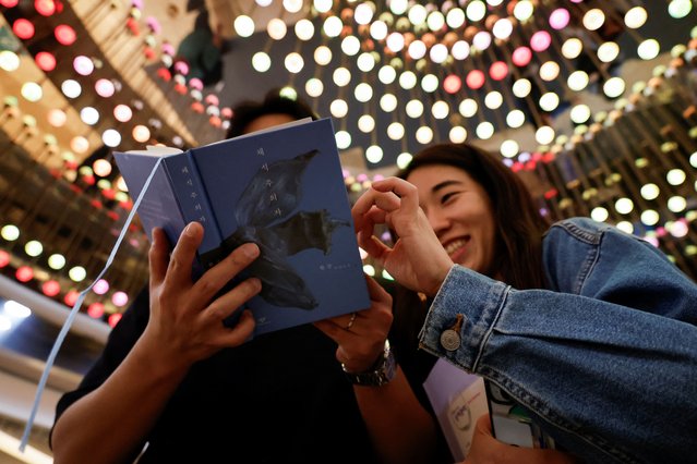 People read the book “The Vegetarian” by Han Kang, who won the 2024 Nobel Prize in Literature, in a bookstore in Seoul, South Korea on October 10, 2024. (Photo by Kim Soo-hyeon/Reuters)