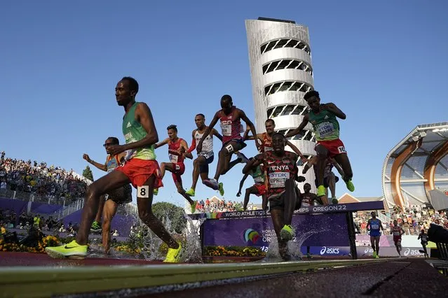 Runners compete during the men's 3000-meter steeplechase final at the World Athletics Championships on Monday, July 18, 2022, in Eugene, Ore. (Photo by Charlie Riedel/AP Photo)