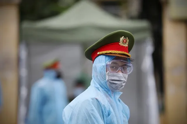 A policeman walks outside a makeshift rapid testing centre, in Hanoi, Vietnam 31 March 2020. Vietnam currently has 148 active cases of coronavirus. Vietnamese Prime Minister Nguyen Xuan Phuc has ordered a 15-day period of isolation nationwide starting 01 April 2020. (Photo by Luong Thai Linh/EPA/EFE)
