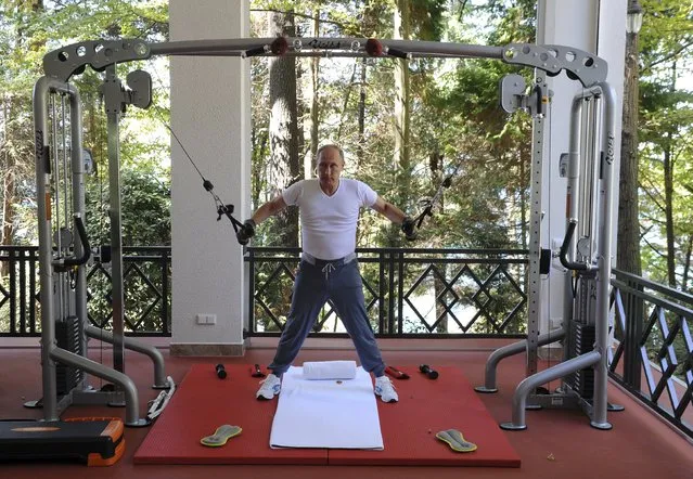 Russian President Vladimir Putin exercises in a gym at the Bocharov Ruchei state residence in Sochi, Russia, August 30, 2015. (Photo by Michael Klimentyev/Reuters/RIA Novosti/Kremlin)