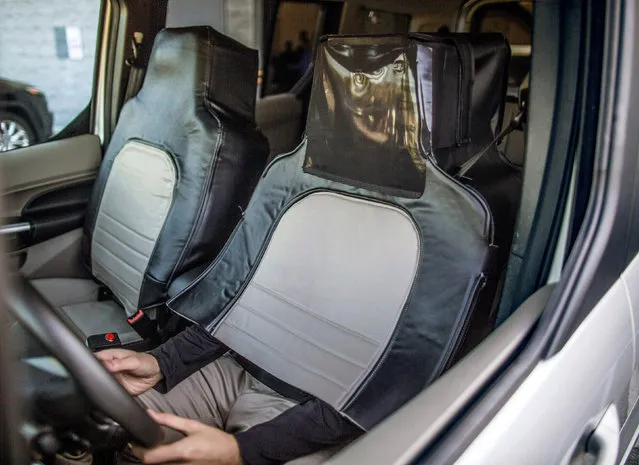 The Ford and Virginia Tech research simulated a self-driving vehicle using a “seat suit” to conceal the human driver. This was done to explore pedestrian reaction to external lighting signals that indicate when the vehicle is driving, yielding or accelerating from a stop in Arlington, Virginia, in this handout photo obtained by Reuters September 13, 2017. (Photo by Reuters/Ford Motor Company)