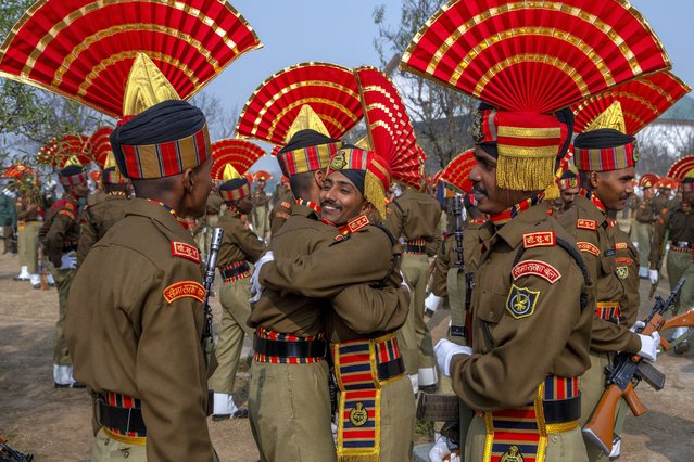 New recruits of the Indian Border Security Force (BSF) hug each other after their graduation parade ceremony in Humhama, outskirts of Srinagar, Indian controlled Kashmir, Thursday, November 9, 2023. A total of 599 recruits were formally inducted into the BSF during the ceremony. (Photo by Dar Yasin/AP Photo)