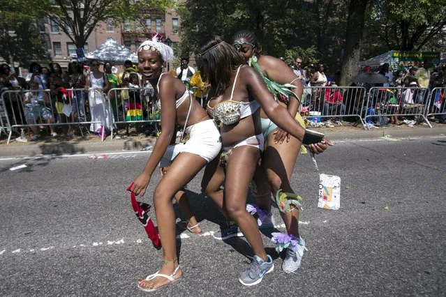 Participants dance during the West Indian Day Parade in Brooklyn, New York September 7, 2015. (Photo by Andrew Kelly/Reuters)