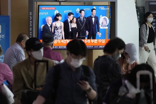 A TV screen show the casting members of Squid Game during a news program at the Seoul Railway Station in Seoul, South Korea, Tuesday, September 13, 2022. (Photo by Ahn Young-joon/AP Photo)