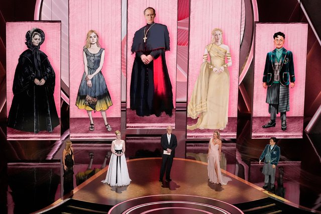 From left, Lily-Rose Depp, Elle Fanning, John Lithgow, Connie Nielsen and Bowen Yang present the Oscar for best costume design during the 97th Annual Oscars at Dolby Theatre on March 02, 2025 in Hollywood, California. (Photo by Chris Pizzello/Invision/AP Photo)