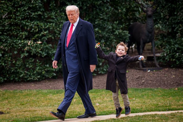 U.S. President Donald Trump and Æ A-Xii, the son of White House Senior Advisor, Tesla and SpaceX CEO Elon Musk, walks towards Marine One on the South Lawn on March 14, 2025 in Washington, DC. Trump is headed to Mar-a-lago in Palm Beach, Florida for the weekend. (Photo by Andrew Harnik/Getty Images)