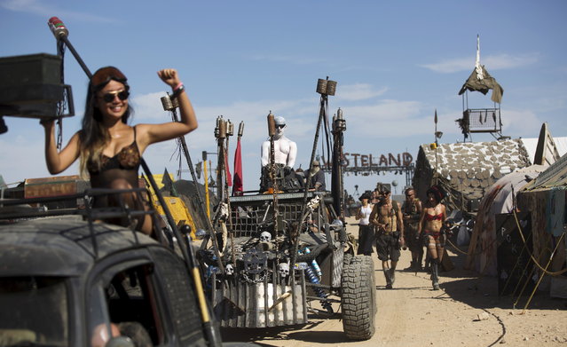 Enthusiasts ride their customized vehicles during the Wasteland Weekend event in California City, California September 26, 2015. (Photo by Mario Anzuoni/Reuters)