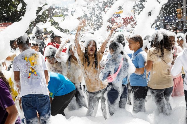 Young people play with foam during a march to commemorate Youth Day in Caracas, Venezuela, 12 February 2025. The president of Venezuela's National Assembly (AN, Parliament), Chavista Jorge Rodriguez, invited, before hundreds of followers who commemorated Youth Day, all young migrants to return to the country so that they can “build a prosperous homeland”. (Photo by Ronald Pena R./EPA)