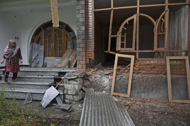 A local resident inspects his house that was damaged by Pakistani artillery shelling in Uri, about 100kms from Srinagar, on May 9, 2025. India said on May 9 it had repulsed a wave of Pakistani drone and artillery attacks overnight, and Islamabad insisted it had not struck targets across the border, as the latest conflict between the nuclear-armed neighbours showed no signs of relenting. (Photo by Tauseef Mustafa/AFP Photo)
