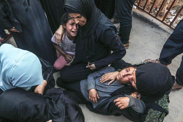 Relatives and loved ones of Palestinians, who lost their lives in Israeli attacks, mourn for their deceased ones at Nasser Hospital as funeral procedures are underway in Khan Yunis, Gaza on May 21, 2025. (Photo by Abed Rahim Khatib/Anadolu via Getty Images)