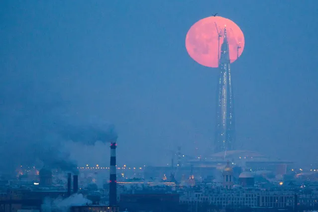 A red supermoon over the tower of the Lakhta Center, which is under construction in Primorsky District of St Petersburg, Russia on January 31, 2018. (Photo by Peter Kovalev/TASS)