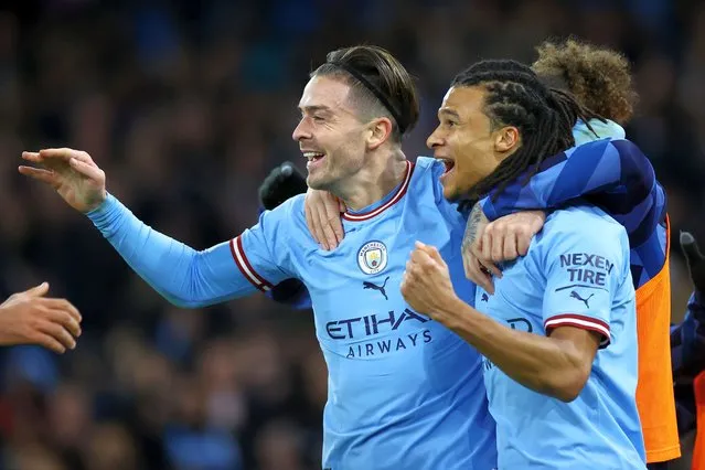 Nathan Ake of Manchester City celebrates after scoring the team's first goal with teammate Jack Grealish during the Emirates FA Cup Fourth Round match between Manchester City and Arsenal at Etihad Stadium on January 27, 2023 in Manchester, England. (Photo by Michael Steele/Getty Images)