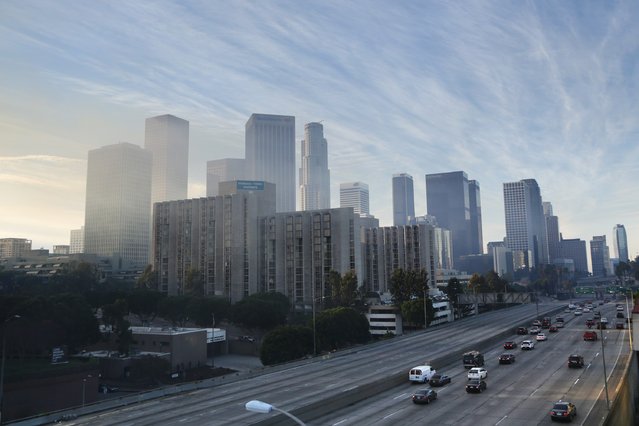 Empty northbound lanes of the 110 freeway are pictured after a large fire consumed an apartment building that was under construction in Los Angeles, California December 8, 2014. (Photo by Jonathan Alcorn/Reuters)
