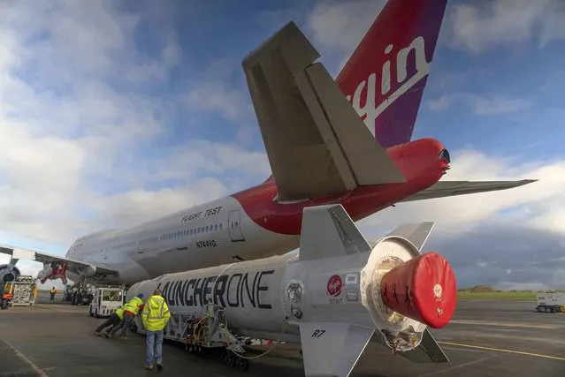 In this undated photo provided by Virgin Orbit on Monday, January 9, 2023, Virgin Atlantic Cosmic Girl, a repurposed Virgin Atlantic Boeing 747 aircraft that will carry a rocket, is parked at Spaceport Cornwall, at Cornwall Airport in Newquay, England. Engineers are making final preparations for the first satellite launch from the U.K. later Monday, when a repurposed passenger plane is expected to release a Virgin Orbit rocket carrying several small satellites into space. (Photo by Virgin Orbit via AP Photo)