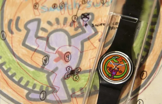 A Swatch designed by Keith Haring is pictured on the artist notes at Sotheby's auction house in Geneva, Switzerland November 4, 2015. Those items are part of the collection of Marlyse Schmid & Bernard Muller, comprising of 4000 items including 1000 watches, among them 380 are prototypes. The duo were designers of the very early Swatch models, developing the watch's iconic design. The collection is expected to fetch US $ 1 million when auctioned during the Important Watches auction in Geneva on November 10. (Photo by Denis Balibouse/Reuters)