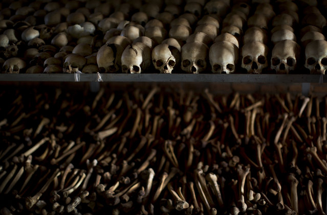 In this Friday, April 4, 2014 file photo, the skulls and bones of some of those who were slaughtered as they sought refuge inside the church are laid out as a memorial to the thousands who were killed in and around the Catholic church during the 1994 genocide in Ntarama, Rwanda. Rwandan President Paul Kagame on Monday, October 10, 2016 criticized French investigators who last week reopened an inquiry into the plane crash that sparked the 1994 genocide in which more than 800,000 people were killed. (Photo by Ben Curtis/AP Photo)