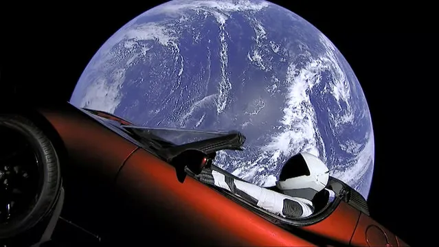 This image from video provided by SpaceX shows the company's spacesuit in Elon Musk's red Tesla sports car which was launched into space during the first test flight of the Falcon Heavy rocket on Tuesday, February 6, 2018. (Photo by SpaceX via AP Photo)