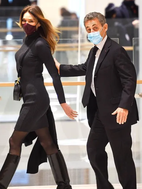 Former French President Nicolas Sarkozy and his spouse Carla Bruni-Sarkozy leave after a hearing in his trial on corruption charges on December 9, 2020 at Paris courthouse. Prosecutors in the landmark corruption trial of French ex-president Nicolas Sarkozy called for him on December 8, 2020 to be sentenced to a prison term of four years of which he should serve two. (Photo by Goff Photos)
