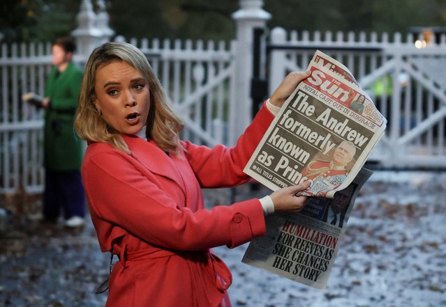 A member of the media shows the front page of a newspaper outside the entrance to the Royal Lodge, a large property on the estate surrounding Windsor Castle, where Andrew, the younger brother of Britain's King Charles lives, in Windsor, Britain, on October 31, 2025. Britain's King Charles has stripped his younger brother Andrew of his title of prince and forced him out of his Windsor home, Buckingham Palace said on Thursday, seeking to distance the royals from him over his links to the Jeffrey Epstein scandal. (Photo by Suzanne Plunkett/Reuters)