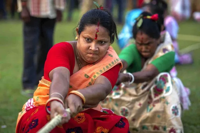 Indian women participate in tug of war during Suwori festival in Boko, west of Guwahati, India, Thursday, April 20, 2023. (Photo by Anupam Nath/AP Photo)