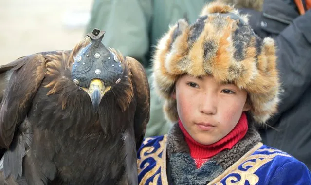 A 7-year-old girl (the youngest in the competition) competed at the Eagle Hunting Festival in Olgiy. (Photo by Brad Ruoho/The Star Tribune)