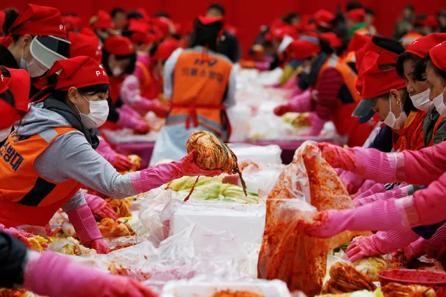 People make traditional side dish Kimchi during the Seoul Kimchi Festival in central Seoul, South Korea, November 4, 2016. (Photo by Kim Hong-Ji/Reuters)