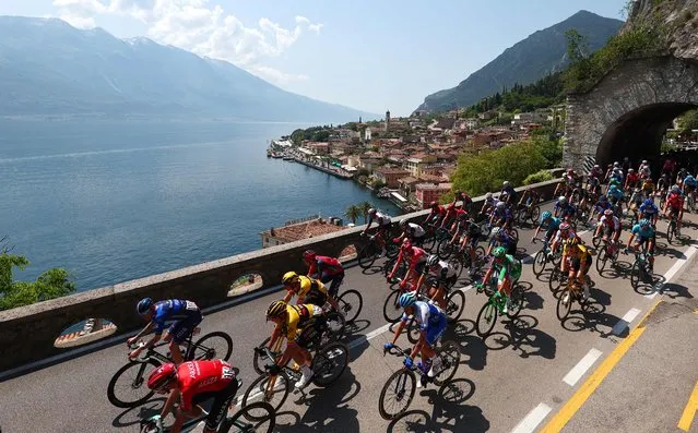 The pack rides during the sixteenth stage of the Giro d'Italia 2023 cycling race, 203 km between Sabbio Chiese and Monte Bondone, near Cavedine, on May 23, 2023. (Photo by Luca Bettini/AFP Photo)