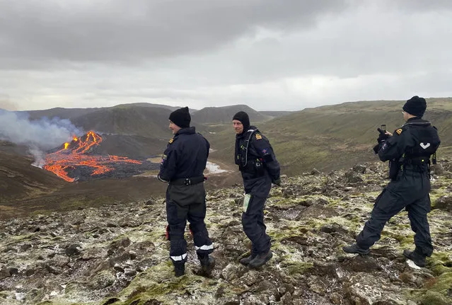 This image provided by the Icelandic Coast Guard shows a volcano on the Reykjanes Peninsula in southwestern Iceland on Saturday March 20, 2021. A long dormant volcano on the Reykjanes Peninsula flared to life Friday night, spilling lava down two sides in that area's first volcanic eruption in nearly 800 years. Initial aerial footage, posted on the Facebook page of the Icelandic Meteorological Office, showed a relatively small eruption so far, with two streams of lava running in opposite directions. (Photo by Icelandic Coast Guard via AP Photo)