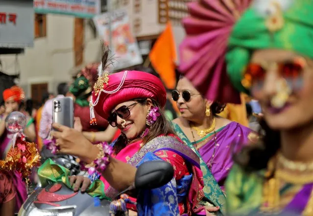 Women wearing traditional headgears attend celebrations to mark the Gudi Padwa festival, the beginning of the New Year for Maharashtrians, in Mumbai, India on April 2, 2022. (Photo by Niharika Kulkarni/Reuters)