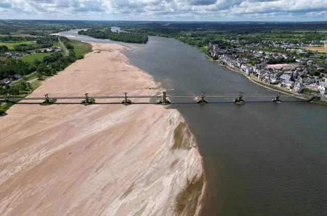 A view shows a bridge with sandbanks of the Loire River in Ingrandes-le-Fresne-sur-Loire, France on May 4, 2023. (Photo by Stephane Mahe/Reuters)