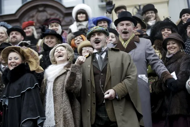 People dress up as characters from Scottish writer Arthur Conan Doyle's stories as they celebrate the birthday of detective Sherlock Holmes, one of Doyle's most famous fictional character, in Riga, Latvia, January 9, 2016. From 1979 to 1986, a Soviet TV film adaptation of the novel titled "The Adventures of Sherlock Holmes and Doctor Watson" shot most of its episodes in Riga. (Photo by Ints Kalnins/Reuters)