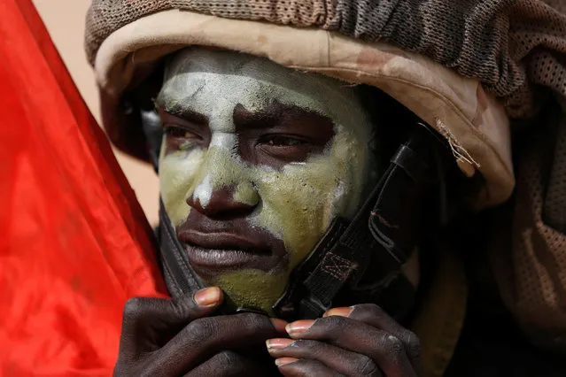 An Israeli soldier from the Desert Reconnaissance battalion takes part in a drill near Kissufim in southern Israel November 29, 2016. A battalion of soldiers crawls across the desert sand with assault rifles cocked. It's a routine exercise, but these are no ordinary troops – they are Arabs who have chosen to fight for the Jewish state. While the vast majority of the Israel Defense Forces (IDF) are Jews - and nearly all their conflicts have been against Arab nations – a trickle of Israeli Arabs volunteer for the army. Most are Bedouin, a community native to southern Israel. But some are other Arab citizens of Israel, the descendants of Palestinians who remained during the 1948 war of the state's founding, when hundreds of thousands of their brethren fled or were forced from their homes by advancing Israeli troops. The military conscripts young Jewish men and women, but not Arabs. It does not report exact numbers of Arab volunteers, but officials say there are several hundred among the 175,000 active personnel. (Photo by Amir Cohen/Reuters)