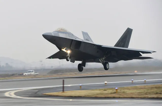A U.S. Air Force F-22 Raptor takes off from a South Korean air base in Gwangju, South Korea, Monday, December 4, 2017. The United States and South Korea have started their biggest-ever joint air force exercise with hundreds of aircrafts including two dozen stealth jets. (Photo by Yonhap via AP Photo)