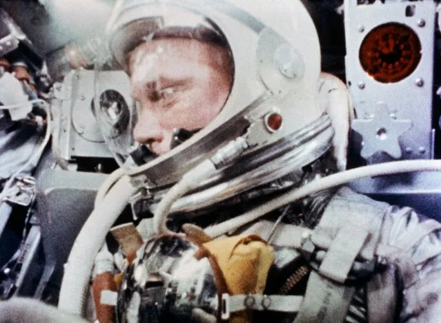 Astronaut John H. Glenn, Jr., is pictured during the Mercury-Atlas 6 spaceflight becoming the first American to orbit Earth, February 20, 1962, in this handout photo taken by a camera onboard the spacecraft, provided by NASA. (Photo by Reuters/NASA)