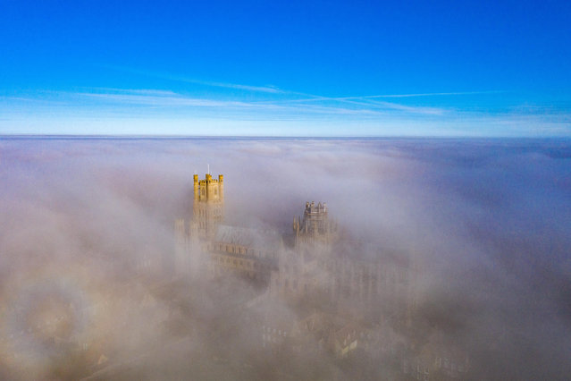 Ely Cathedral, also known as the “Ship of the Fens” rises majestically above the mist in Ely, United Kingdom on February 28, 2021. (Photo by Terry Harris/Rex Features/Shutterstock)